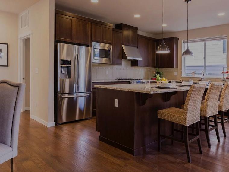 Open kitchen and dining area with new hardwood flooring