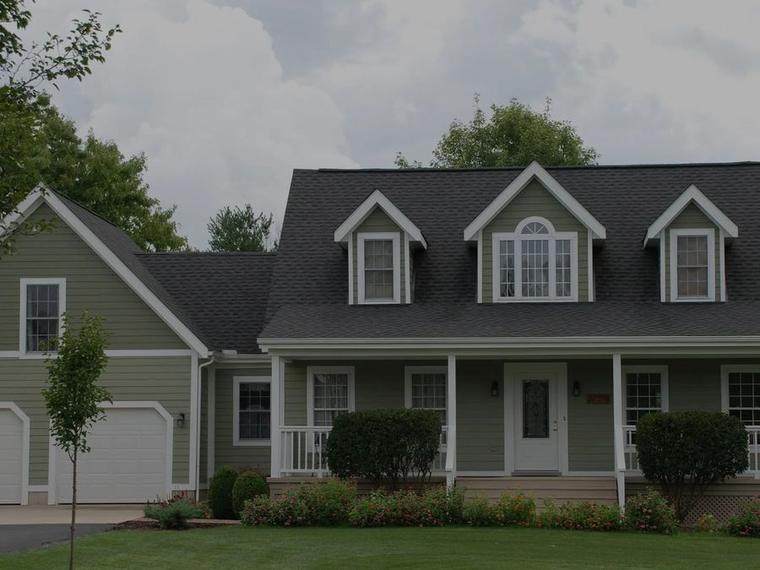 Two-story Green Bay home with finished siding and trim